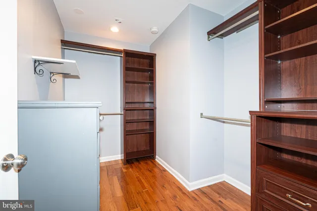 a bathroom with double vanity sinks and a mirror