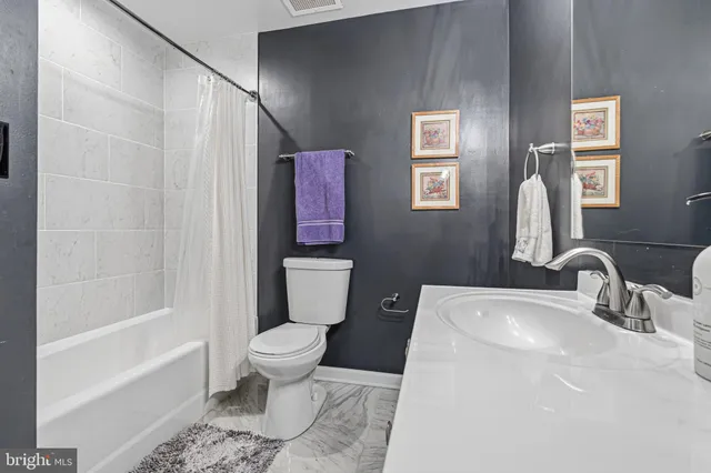 a view of a bedroom with washer and dryer