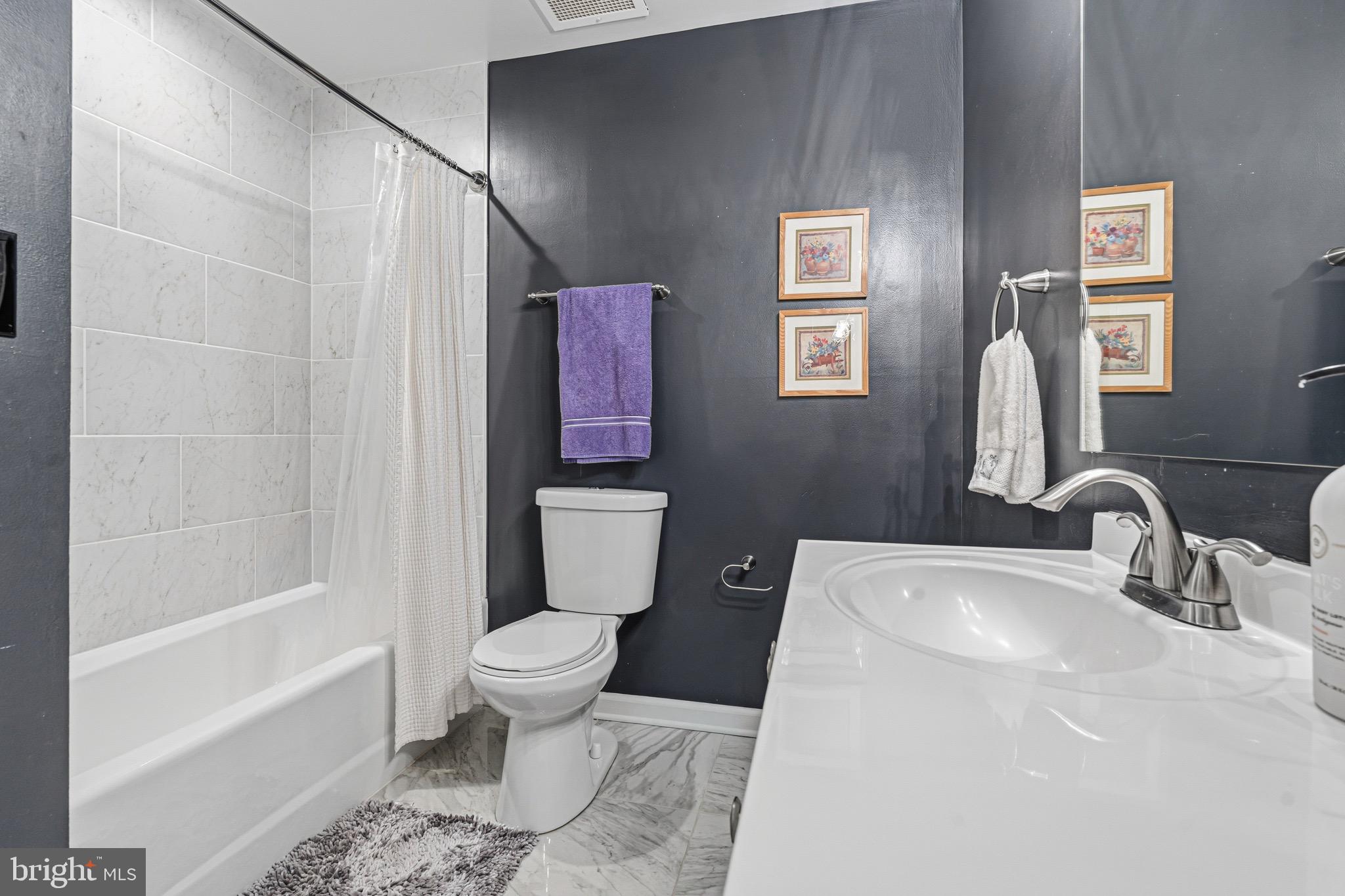 10 East Lee Street, Unit 808 Baltimore, MD 21202 - Photo 28 of 32 a bathroom with a sink toilet and shower