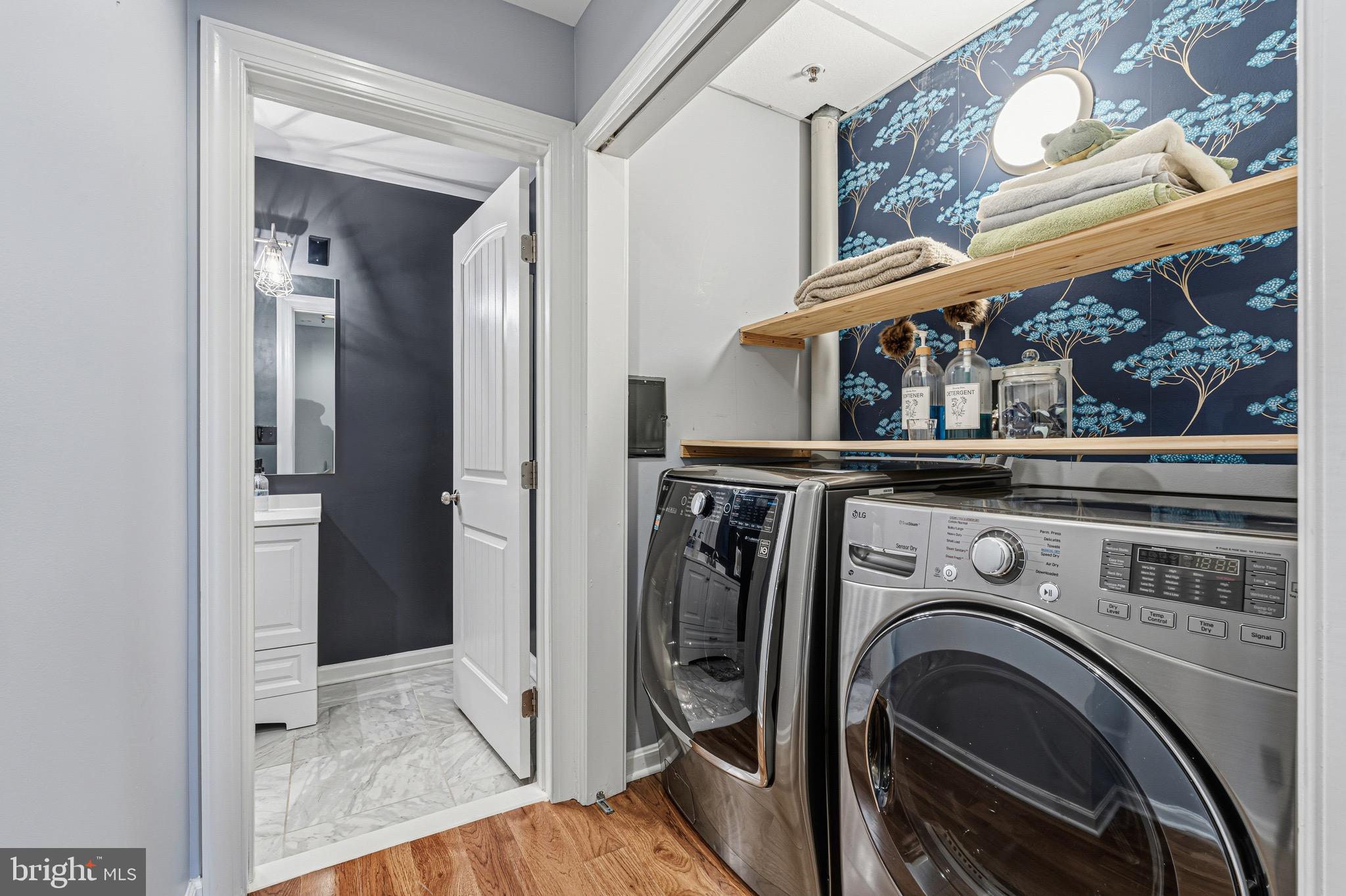 10 East Lee Street, Unit 808 Baltimore, MD 21202 - Photo 29 of 32 a view of a bedroom with washer and dryer