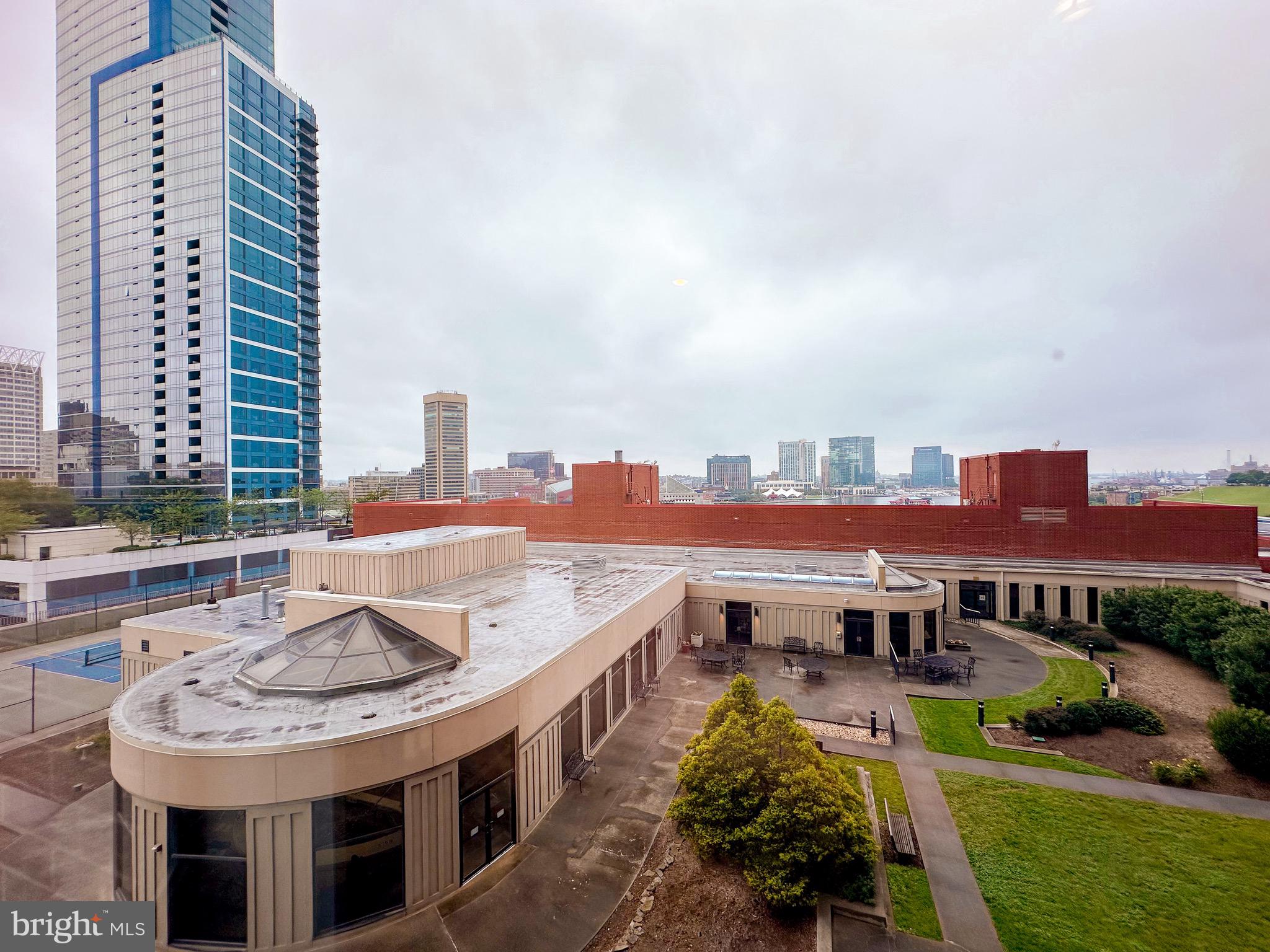 10 East Lee Street, Unit 808 Baltimore, MD 21202 - Photo 31 of 32 a view of a city that has tall buildings