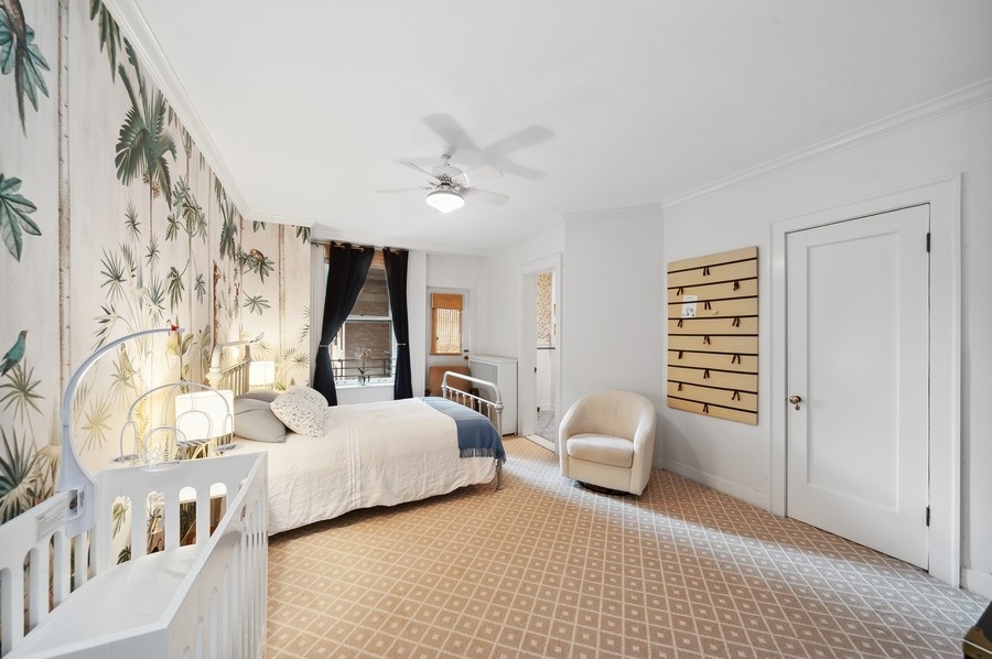 3100 North Sheridan Road, Unit 4B Chicago, IL 60657 - Photo 13 of 19 a bedroom with furniture and a window