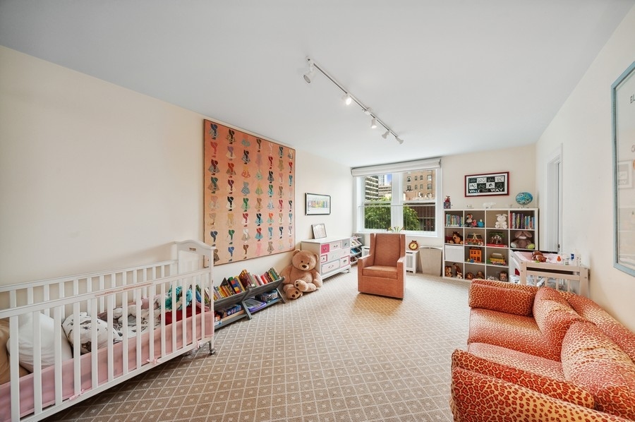 3100 North Sheridan Road, Unit 4B Chicago, IL 60657 - Photo 14 of 19 a living room with furniture and a large window