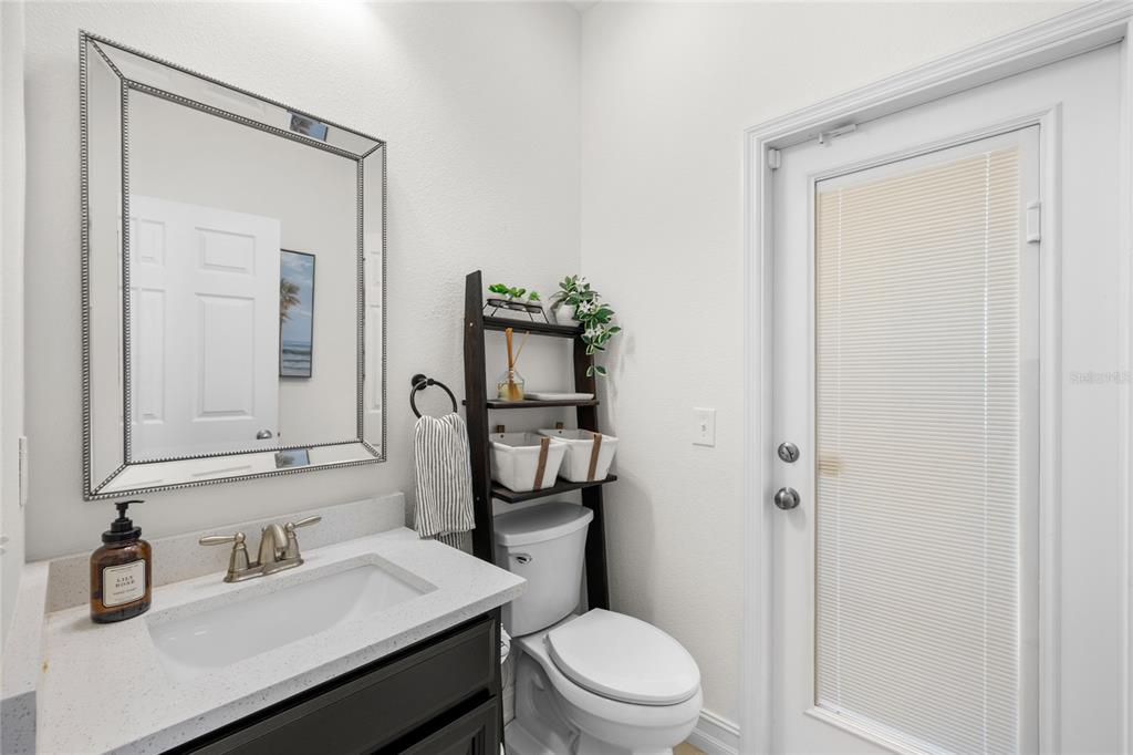 8764 Lookout Pointe Drive Windermere, FL 34786 - Photo 25 of 53 a bathroom with a toilet a sink and mirror