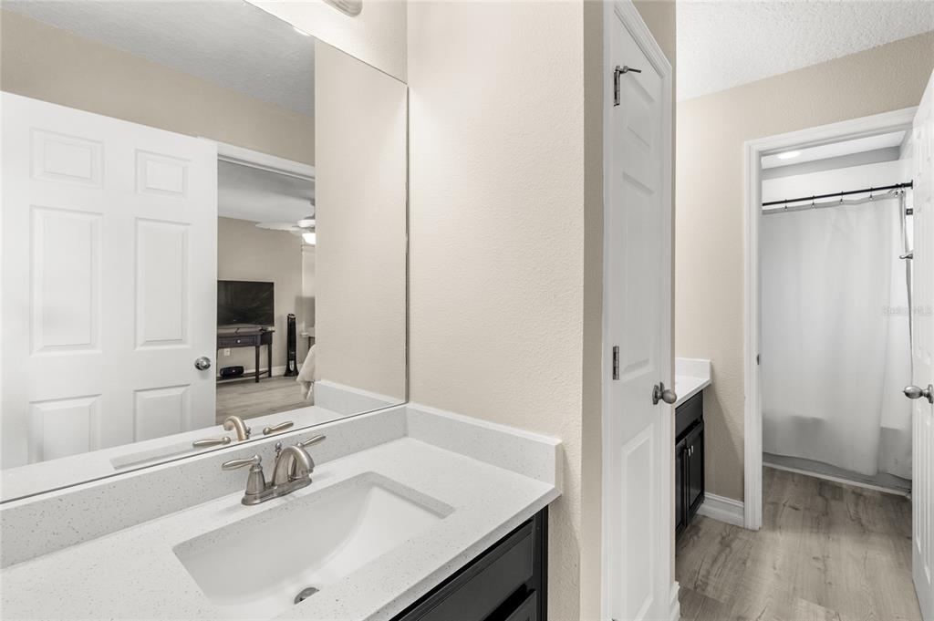 8764 Lookout Pointe Drive Windermere, FL 34786 - Photo 41 of 53 a bathroom with a sink and a mirror