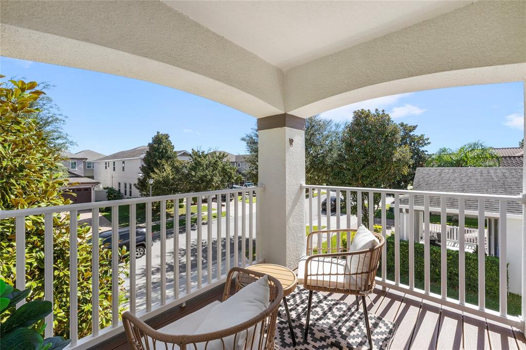8764 Lookout Pointe Drive Windermere, FL 34786 - Photo 44 of 53 a view of a chair and table in the balcony