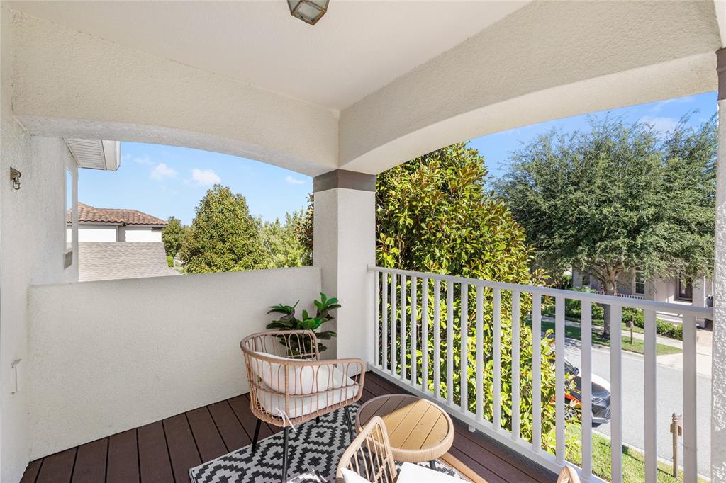 8764 Lookout Pointe Drive Windermere, FL 34786 - Photo 45 of 53 a view of a chairs and table in the balcony