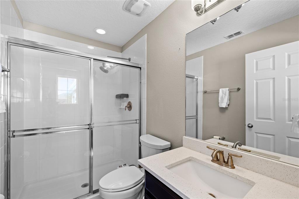 8764 Lookout Pointe Drive Windermere, FL 34786 - Photo 47 of 53 a bathroom with a sink toilet and shower