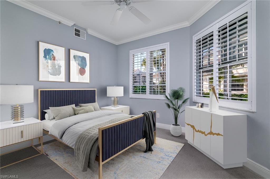 2090 Aberdeen Lane, Unit 101 Naples, FL 34109 - Photo 11 of 37 a bedroom with a large bed and a window