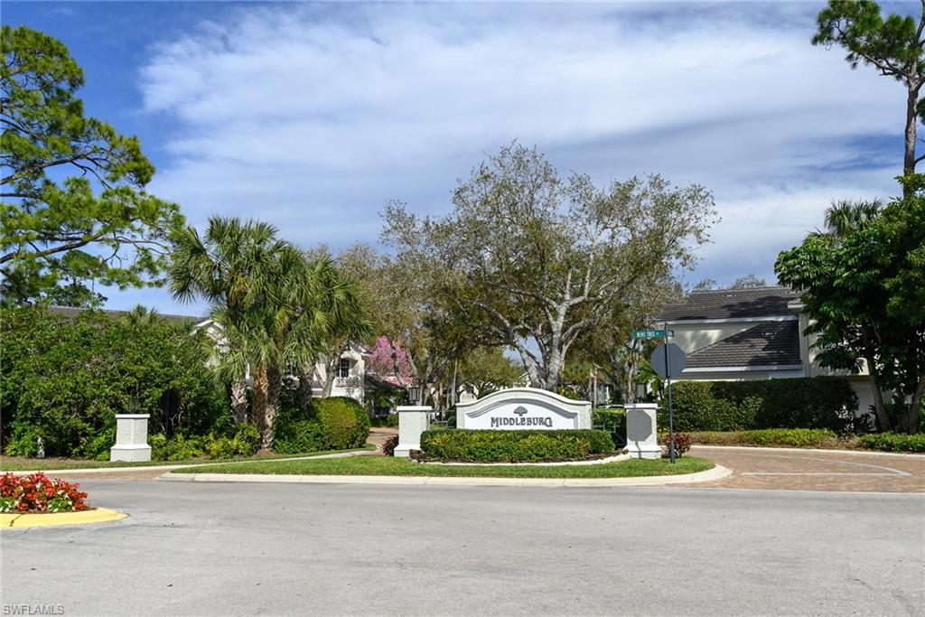 2090 Aberdeen Lane, Unit 101 Naples, FL 34109 - Photo 18 of 37 a view of a parked cars in front of a building