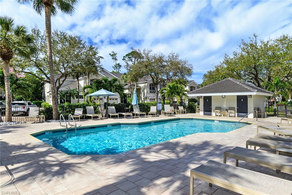 2090 Aberdeen Lane, Unit 101 Naples, FL 34109 - Photo 20 of 37 a view of a house with garden and trees