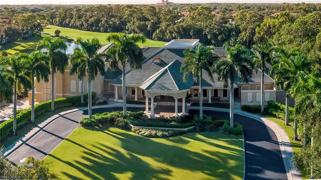 2090 Aberdeen Lane, Unit 101 Naples, FL 34109 - Photo 22 of 37 a house with swimming pool in front of it