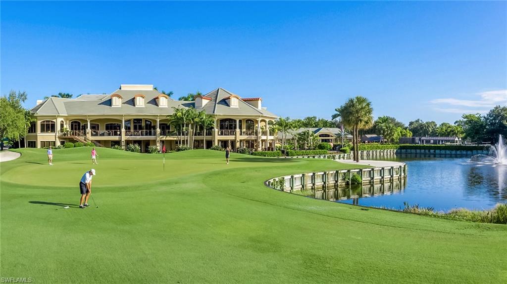 2090 Aberdeen Lane, Unit 101 Naples, FL 34109 - Photo 25 of 37 a front view of a house with garden