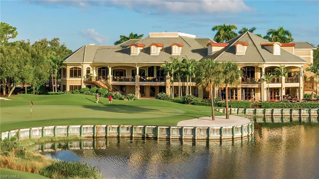 2090 Aberdeen Lane, Unit 101 Naples, FL 34109 - Photo 26 of 37 a front view of a house with garden