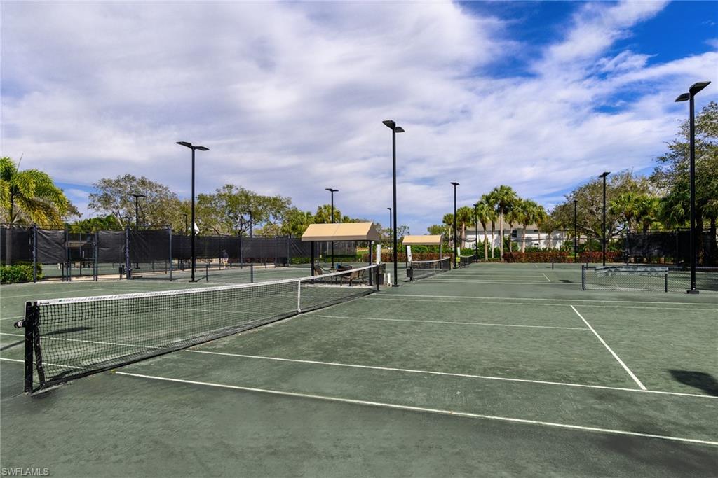 2090 Aberdeen Lane, Unit 101 Naples, FL 34109 - Photo 34 of 37 a view of a tennis court
