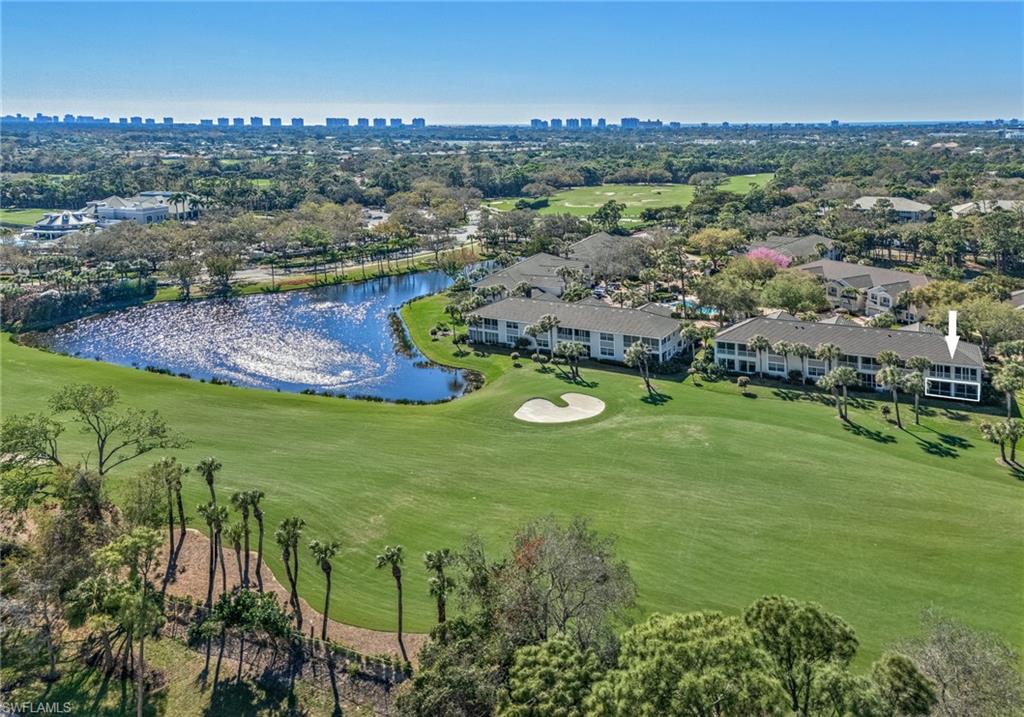 2090 Aberdeen Lane, Unit 101 Naples, FL 34109 - Photo 37 of 37 an aerial view of residential houses with outdoor space and trees