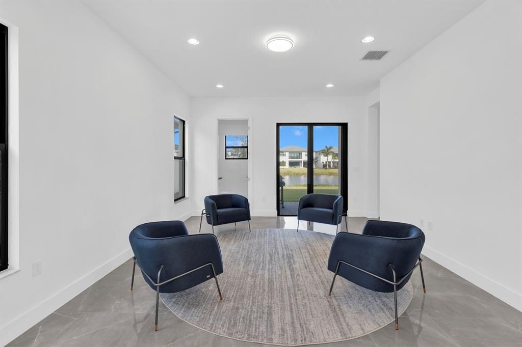 8571 Shoreacres Street Boca Raton, FL 33434 - Photo 29 of 95 Game Room/ Pool Room/ Flex area on 1st Floor