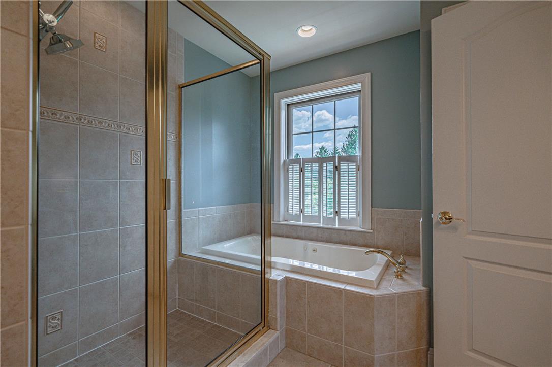 6000 Pond View Terrace Bath, PA 18014 - Photo 40 of 69 Indulge in a tranquil bathing experience with this spacious soaking tub and adjacent walk-in shower.