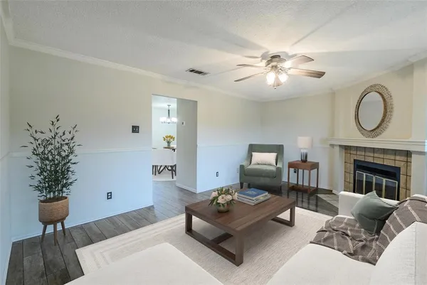 a living room with furniture and a fireplace