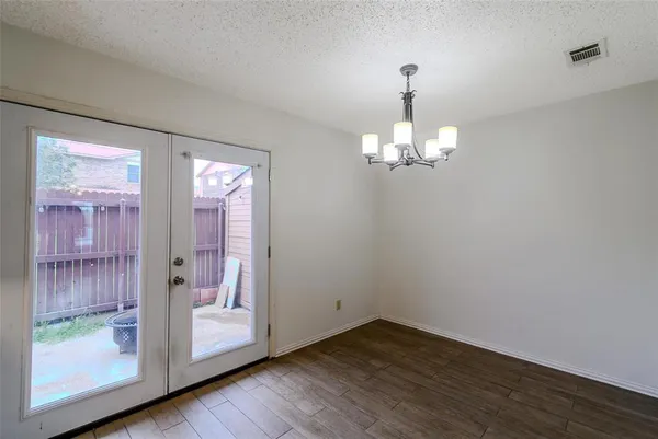 a view of a chandelier in wooden floor
