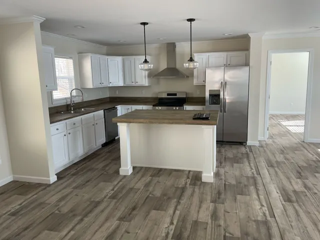 a kitchen with granite countertop a stove and a sink