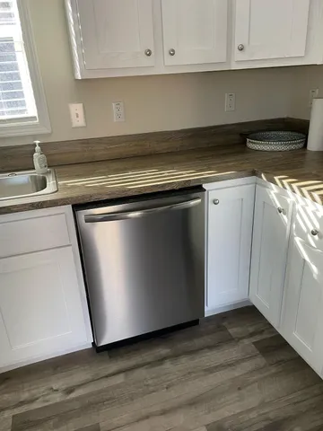 a bathroom with a toilet a sink and shower