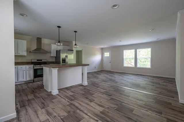 a bathroom with a sink toilet vanity and shower