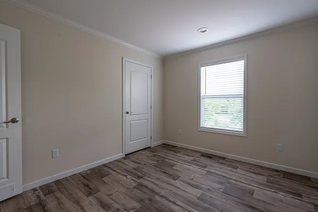 a view of a field with an trees