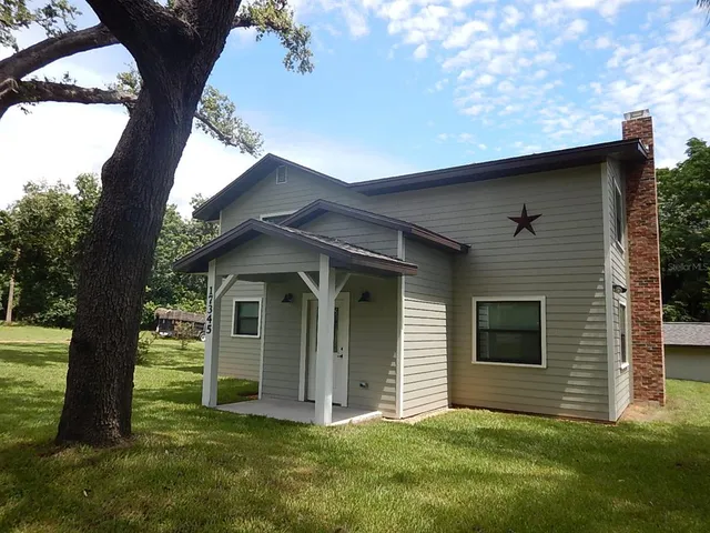 a view of front door and yard