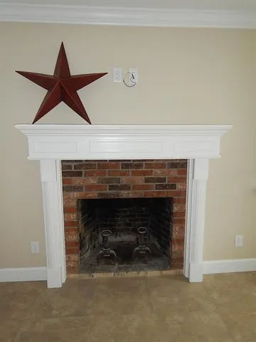 a living room with a fireplace