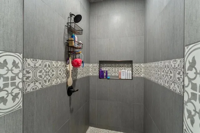 a large bathroom with a double vanity sink mirror and