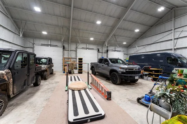 a living room with lots of furniture and a chandelier