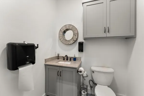 a bathroom with a toilet and a sink