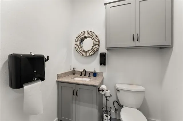 a bathroom with a toilet and a sink