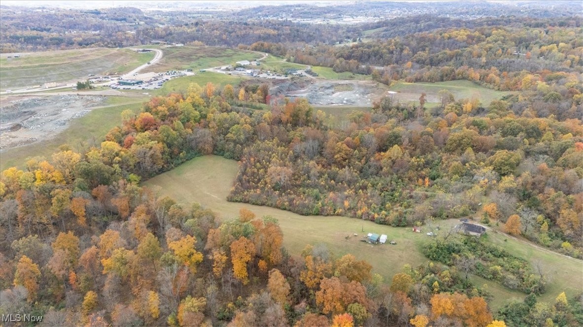 861 Roth Road Parkersburg, WV 26104 - Photo 6 of 20 Aerial view of property and surrounding area with a heavily wooded area