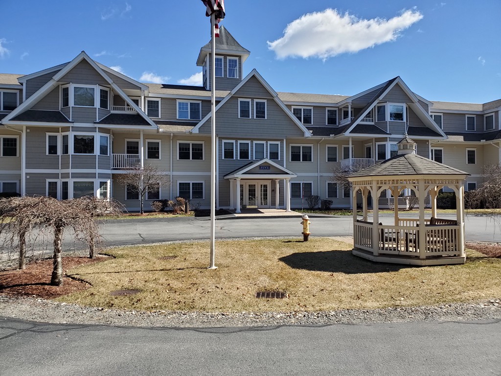 5 Mission Road, Unit 304 Chelmsford, MA 01863 - Photo 1 of 30 a front view of houses with yard
