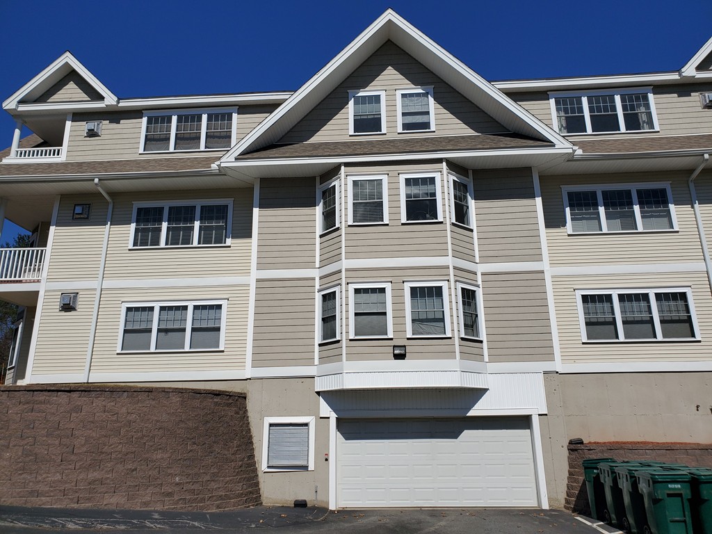 5 Mission Road, Unit 304 Chelmsford, MA 01863 - Photo 25 of 30 a front view of a house with a yard