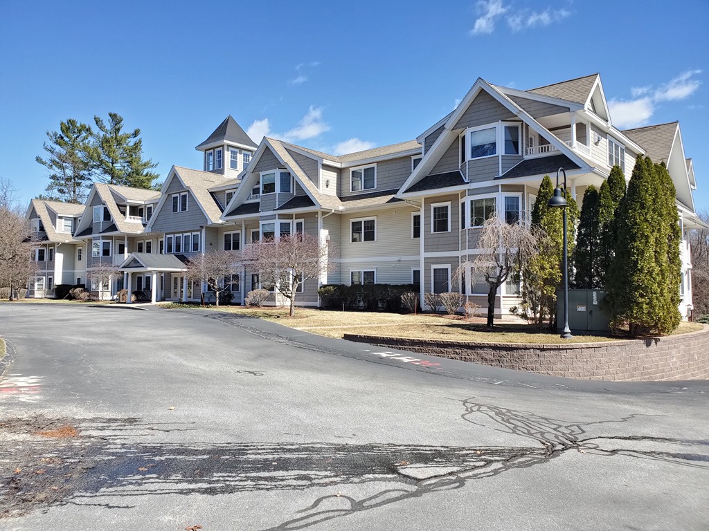 5 Mission Road, Unit 304 Chelmsford, MA 01863 - Photo 27 of 30 a front view of residential houses with yard