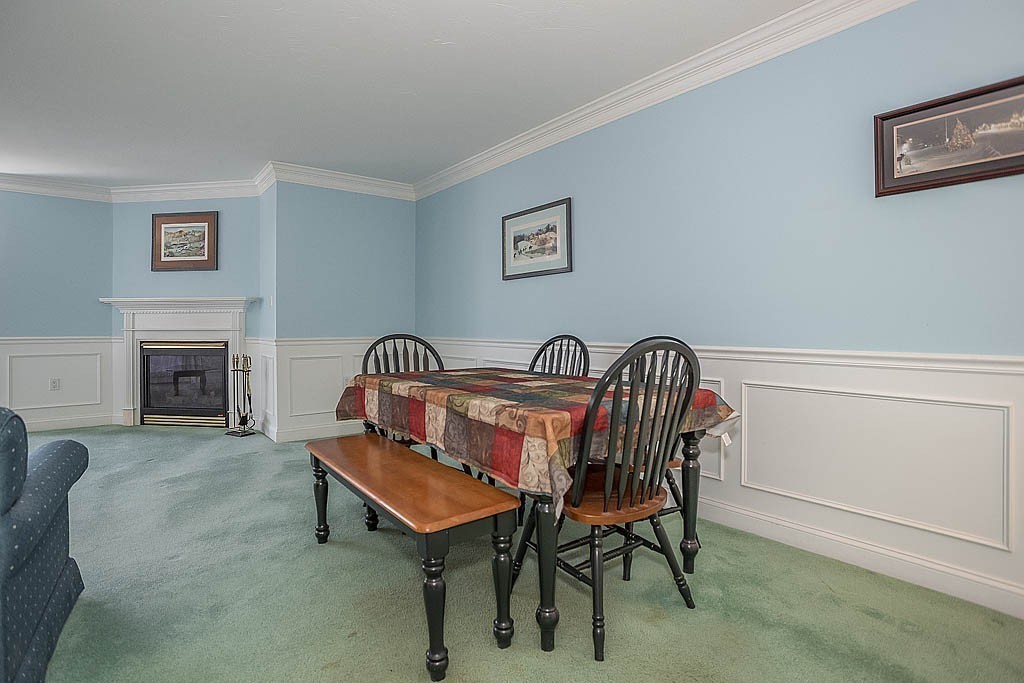 5 Mission Road, Unit 304 Chelmsford, MA 01863 - Photo 5 of 30 a living room with furniture and a fireplace