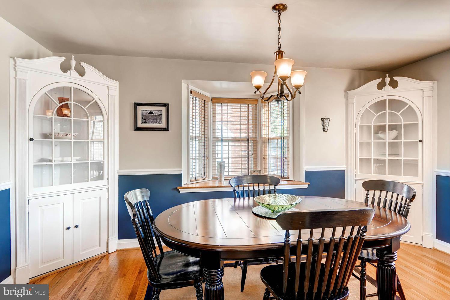 1615 Hardwick Road Towson, MD 21286 - Photo 12 of 30 a dining room with furniture a chandelier and wooden floor