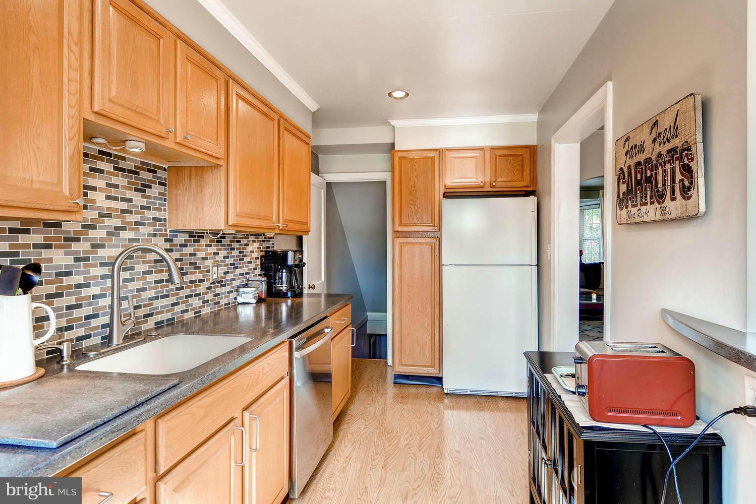 1615 Hardwick Road Towson, MD 21286 - Photo 15 of 30 a kitchen with stainless steel appliances granite countertop a refrigerator and a sink