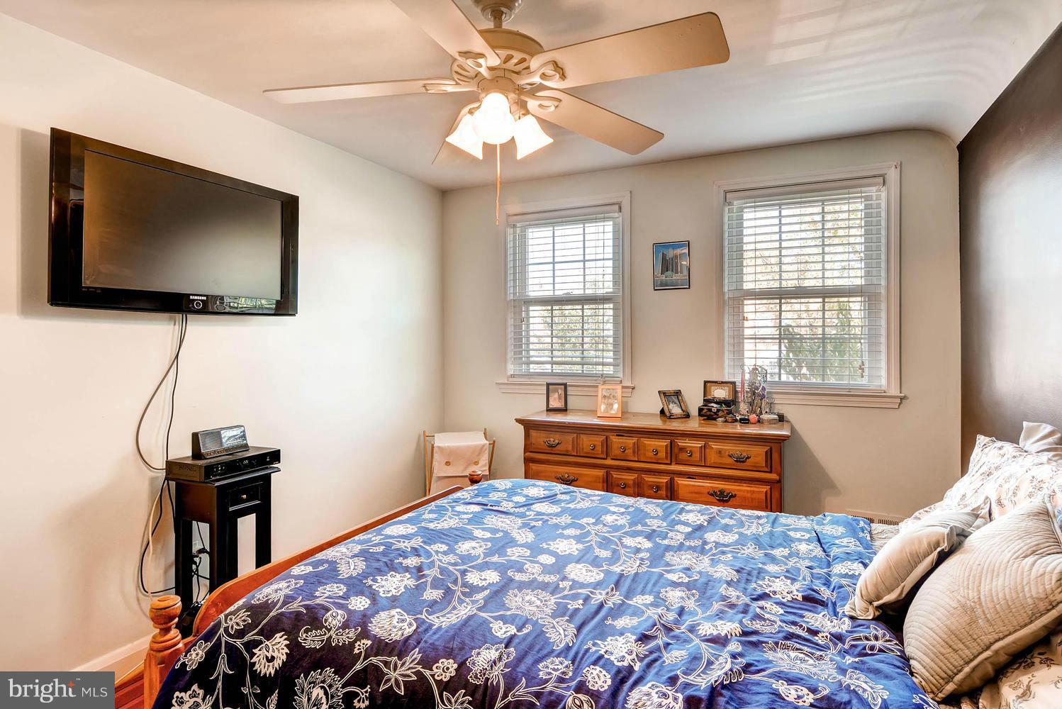 1615 Hardwick Road Towson, MD 21286 - Photo 17 of 30 a bedroom with a bed and a flat screen tv