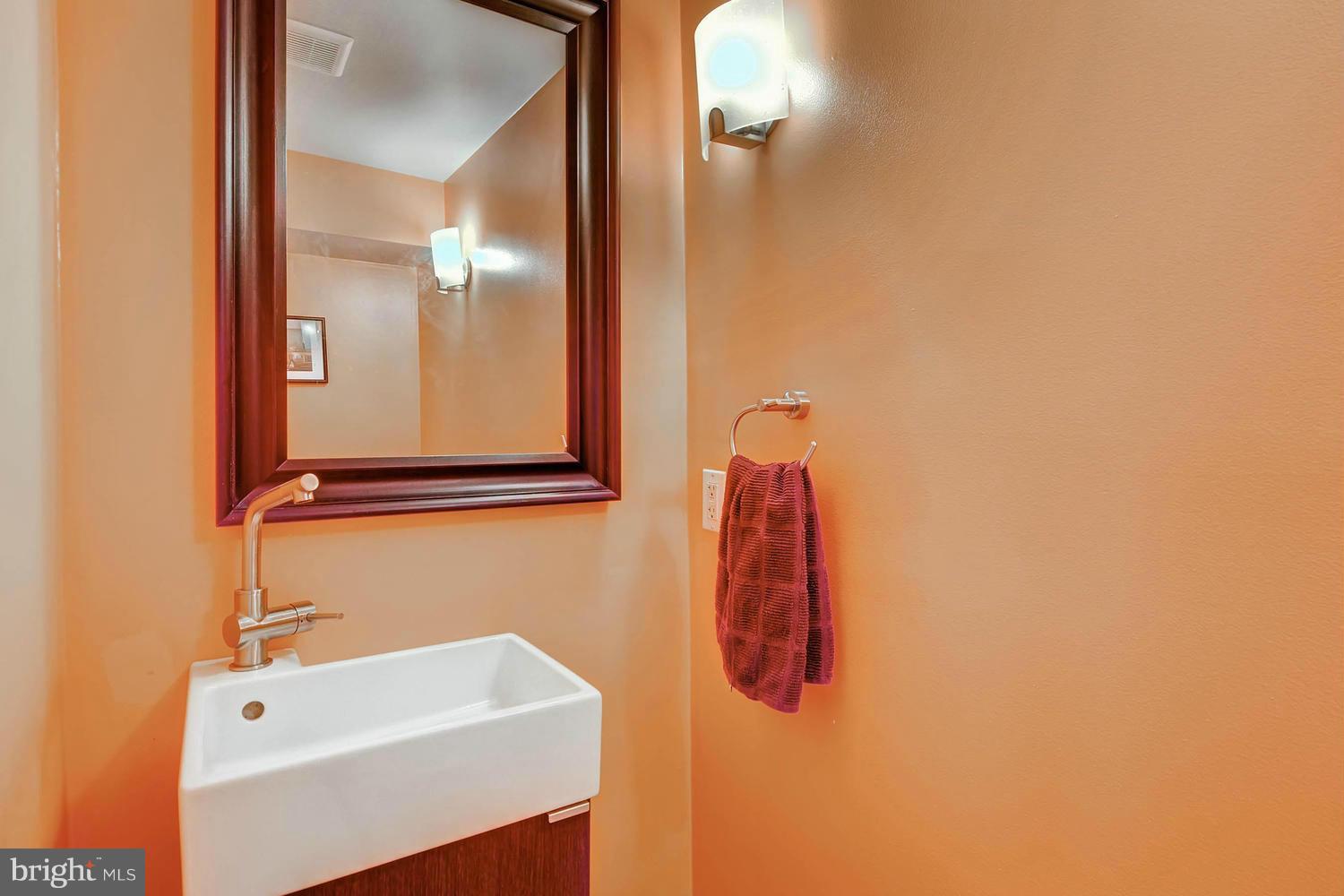 1615 Hardwick Road Towson, MD 21286 - Photo 24 of 30 a bathroom with a sink and a mirror
