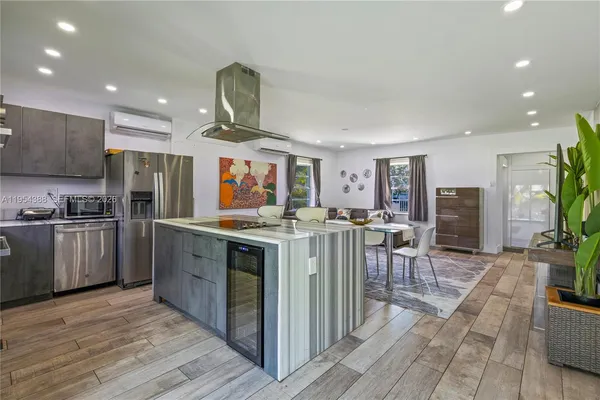 a kitchen with lots of counter top space and appliances