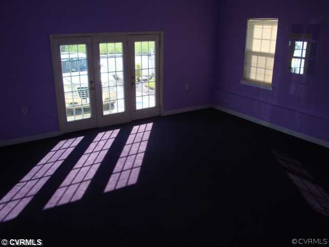 5506 Willow Grove Road Chesterfield, VA 23832 - Photo 3 of 9 a view of an empty room with wooden floor and a window