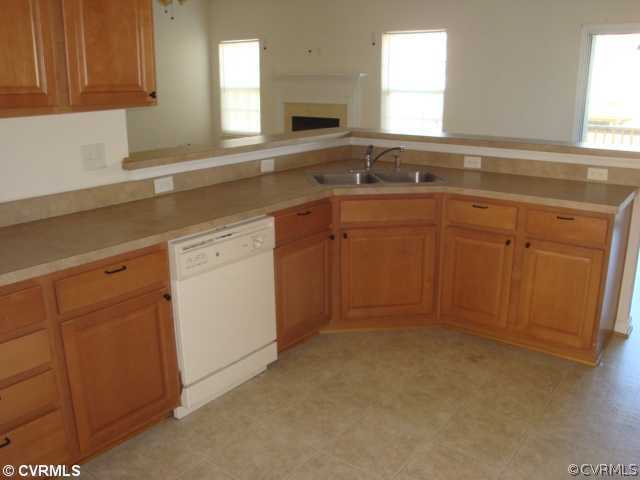 5506 Willow Grove Road Chesterfield, VA 23832 - Photo 5 of 9 a kitchen with a sink cabinets and window