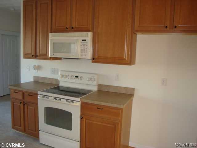 5506 Willow Grove Road Chesterfield, VA 23832 - Photo 6 of 9 a stove top oven sitting inside of a kitchen