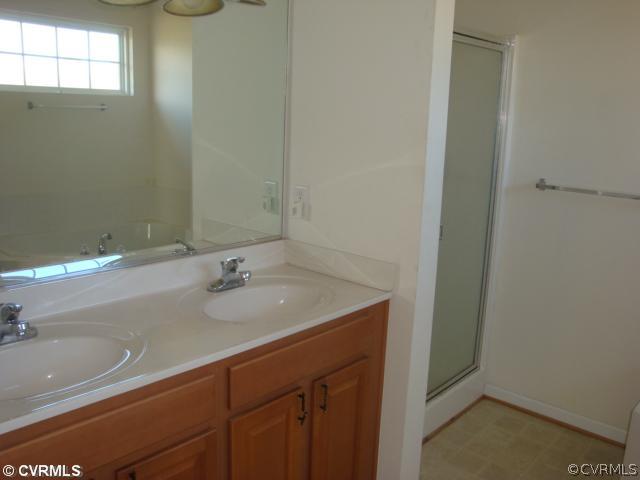 5506 Willow Grove Road Chesterfield, VA 23832 - Photo 8 of 9 a bathroom with a sink and a mirror