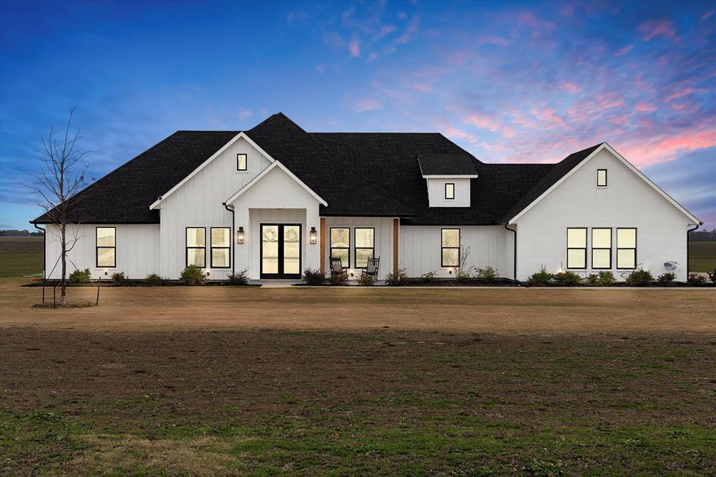 1420 Farrar Road Palmer, TX 75152 - Photo 1 of 1 Modern farmhouse style home featuring a lawn and french doors