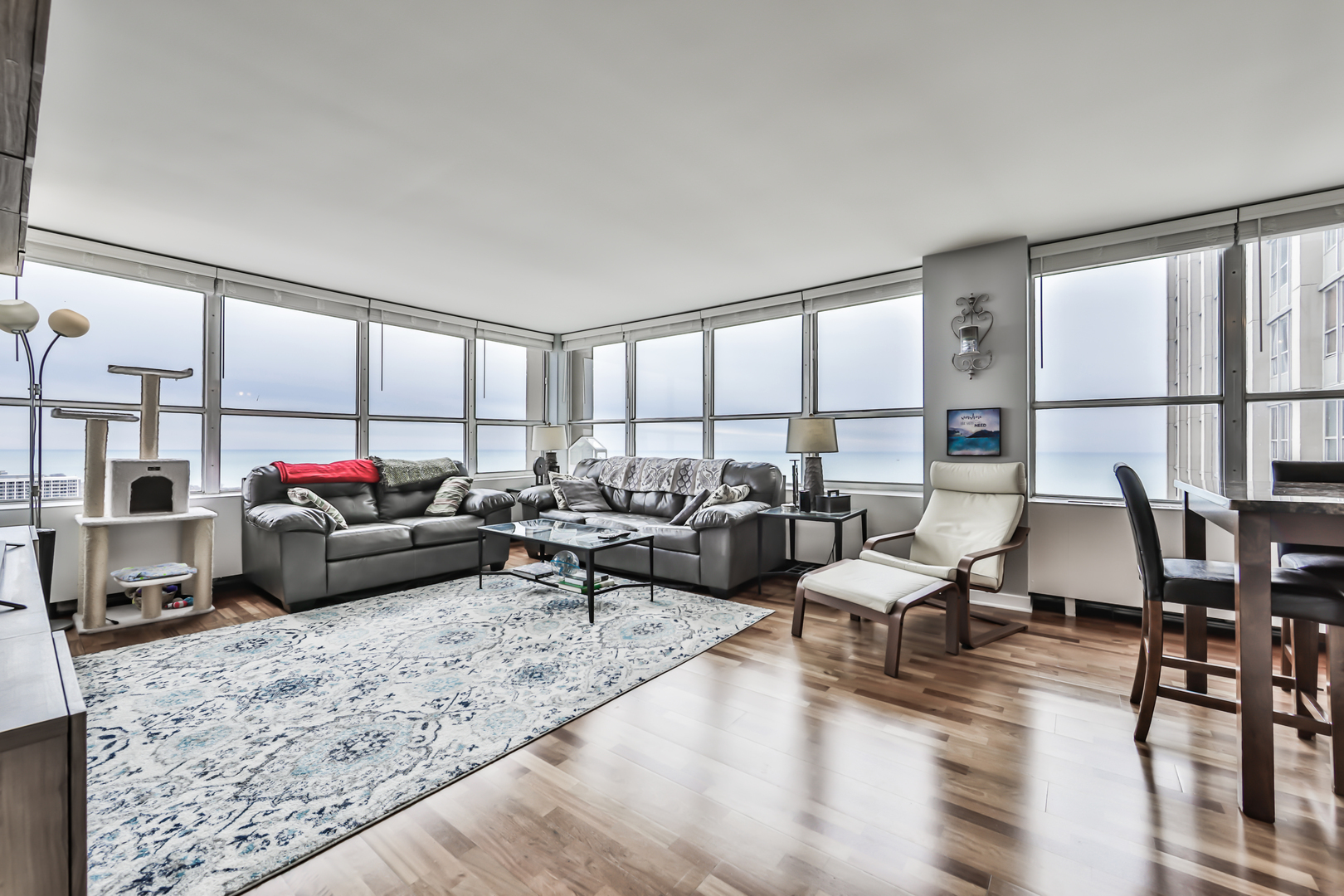 655 West Irving Park Road, Unit 3810 Chicago, IL 60613 - Photo 6 of 26 a living room with furniture or couch and a table